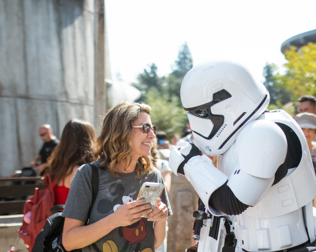 Guest enjoying a conversation with a storm trooper