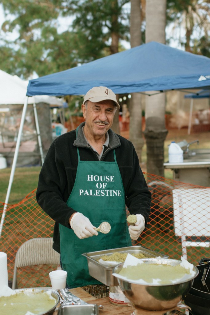 Volunteer from the House of Palestine making falafel