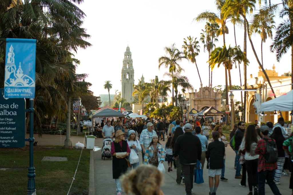 Bustling crown down El Prado Road