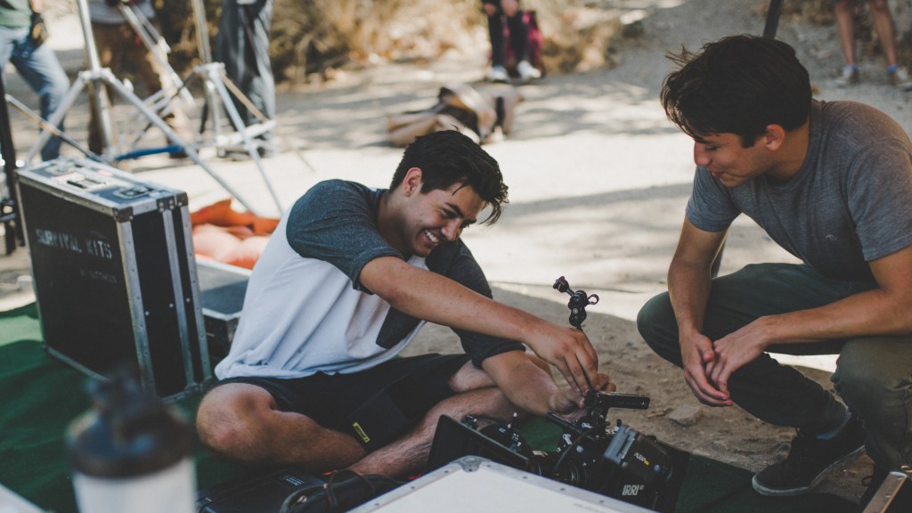 Gabe Sandoval and Evan Galeano setting up a camera