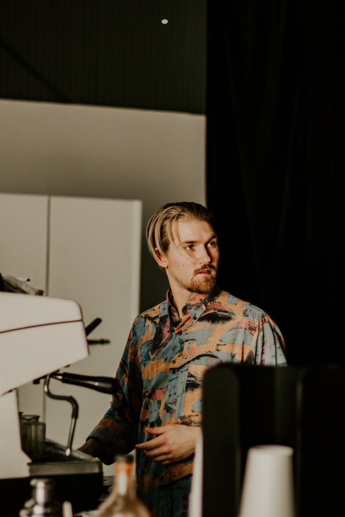 Justin Esselstrom making a drink