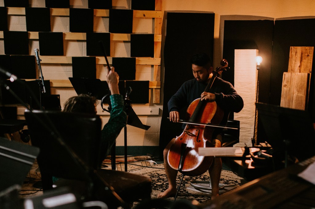 Cellist checking sound signals