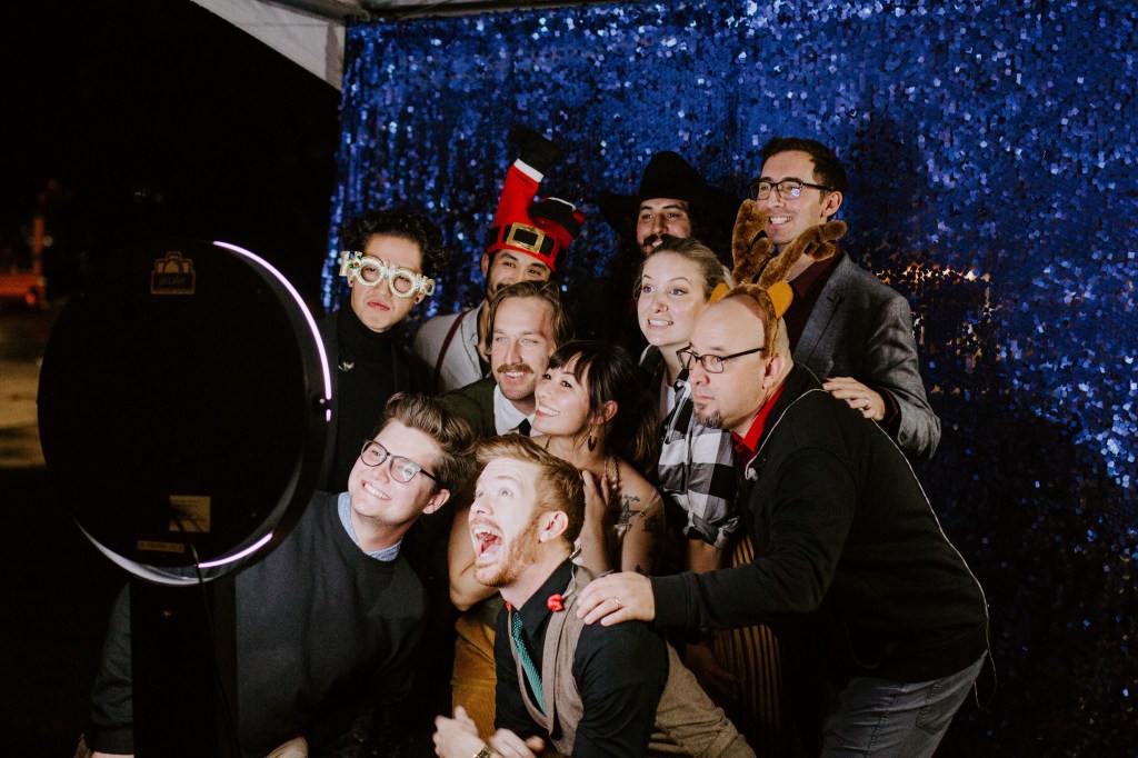 Band taking a shot in the photo booth